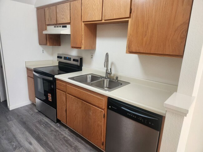 Building Photo - A Must See! Nice and bright, lots of light, two story condo in a well maintained complex.