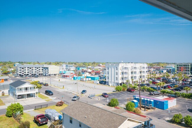 Building Photo - SPEND YOUR OFF-SEASON AT THIS TOP FLOOR OCEANFRONT CONDO