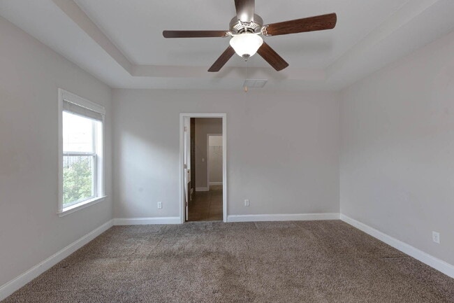 Building Photo - 4BR/3.5BA · 2,809 SF · Owner's Suite on Main · Fenced Yard · Midland, GA — $2,800/mo