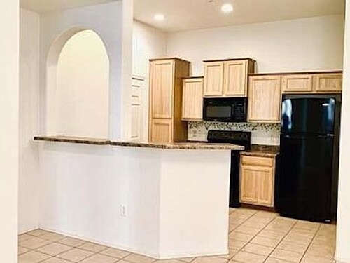 Kitchen with bar - 14575 W Mountain View Blvd