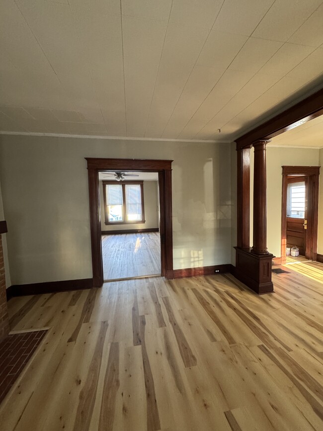 Living room with pocket door open - 925 Walnut St.