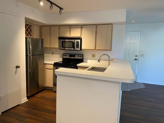 Building Photo - Stylish 2 Bed, 2 Bath Condo with New Vinyl...