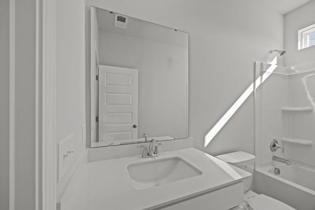 Building Photo - This brand-new home makes a statement from the moment you arrive!