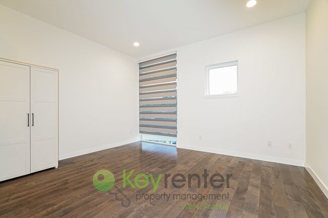 Building Photo - Rooftop Living with Open Concept Design and Parking Included