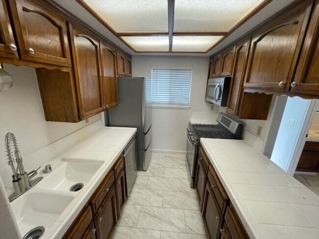 Building Photo - "Coming Soon" Awesome corner 2 Bedroom 2 Bath Townhome with large private patio (AC/Pool/Gated Pa...