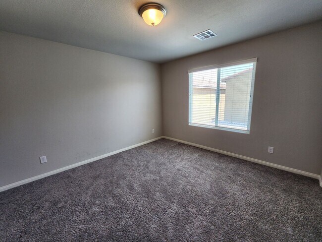 Building Photo - A Fairly New Home with 5 Bedrooms in a gated community
