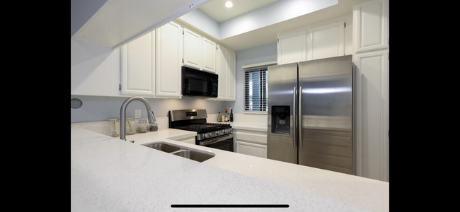 Kitchen with tons of storage - 8707 Falmouth Ave