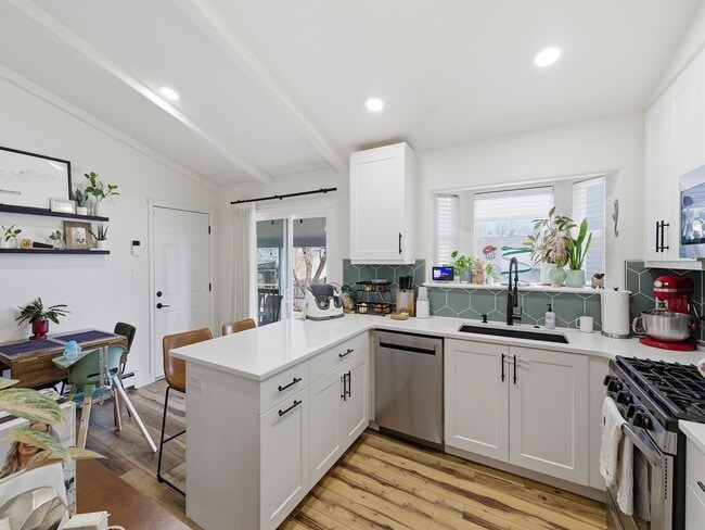 Building Photo - Bright Ranch Home with 2-Car Garage, Finished Basement, and Spacious Yard