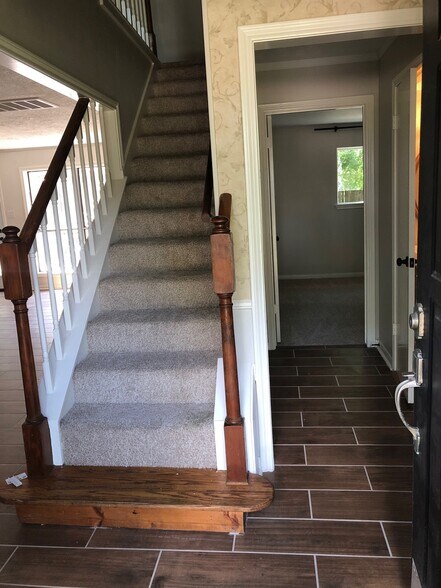 View from front door entrance - all new carpet on stairs. - 10019 Golden Sunshine Dr
