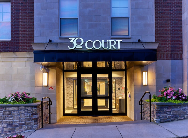 Welcome to 30 Court, where modern elegance meets inviting comfort. - 30 Court Street Apartments