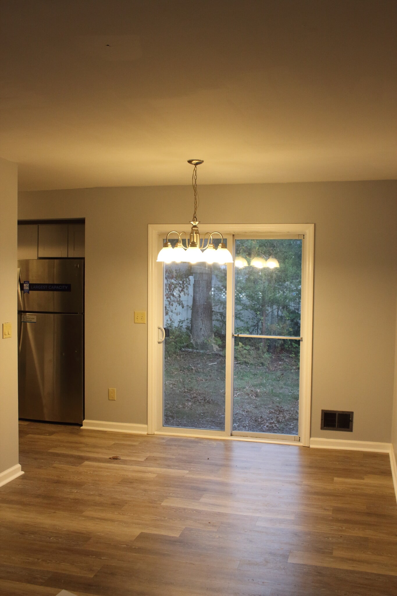 Open concept Living room looking into dining area - 573 Innkeeper Ln