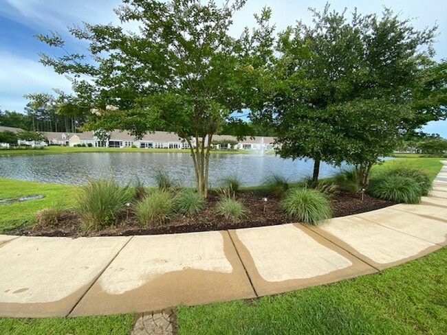 Building Photo - Welcome to this fully furnished 3-bedroom, 3-bathroom townhouse located in the vibrant Hawkeswate...