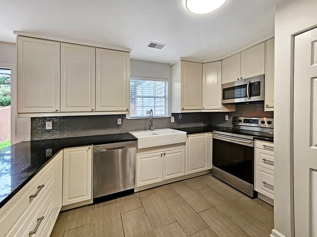 Building Photo - COMING SOON: Beautifully Updated 2/2.5 Townhome Near Truist Park