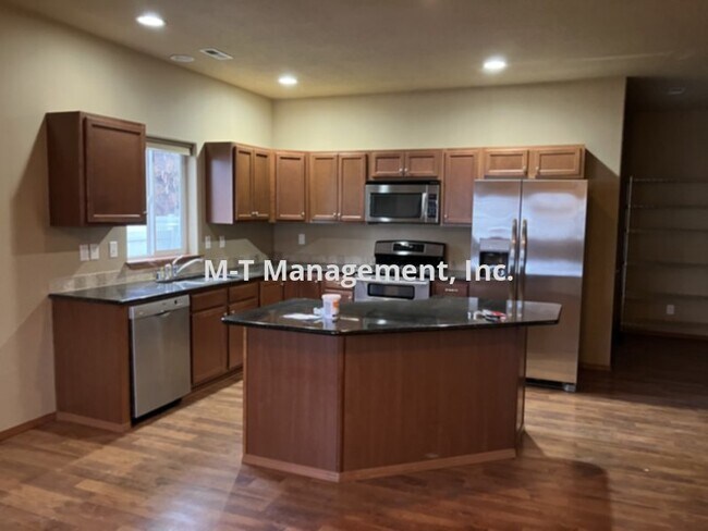 Building Photo - Millwood 3 br/2 bath house + 3 car garage,...