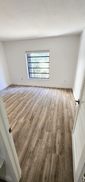 Bedroom with new tile - 10403 N Kendall Dr