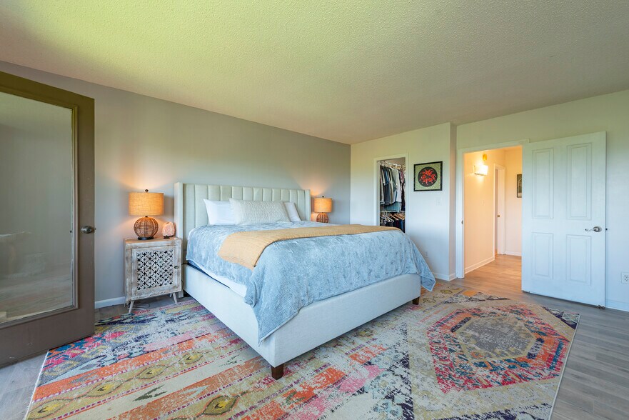 Generously scaled primary suite offering a completely private retreat. - 405 Windswept Dr