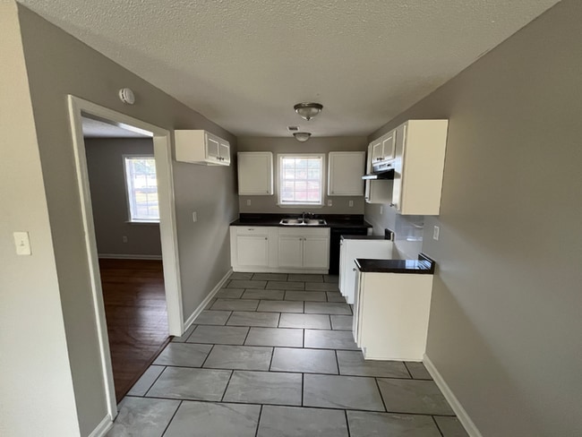 Building Photo - Large 4BR/2BA Whitehaven Home | 2,393 Sq Ft, Stone Fireplace, Hardwood BRs & 2-Car Garage
