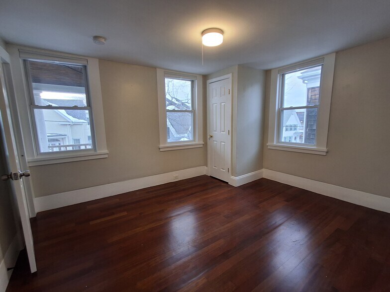 Primary Bedroom: Newly refinished cherry hardwood flooring. - 13 Mulberry St
