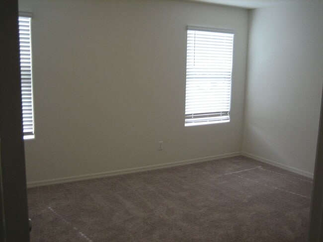 Building Photo - Beautiful 3 Bd, 2.5 bt Two Story home in a gated community with 2 car garage.