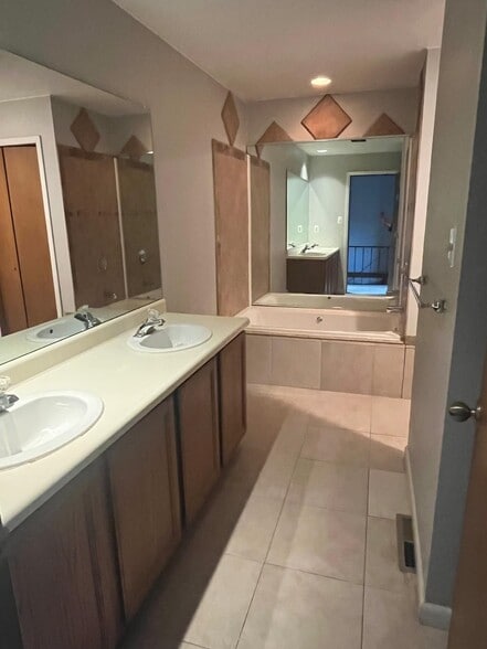 Bathroom with double vanity, walk in shower, and tub - 3124 Banksville Ave