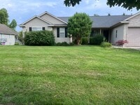 Building Photo - Spacious Duplex in Walker! Two Stall Garage!