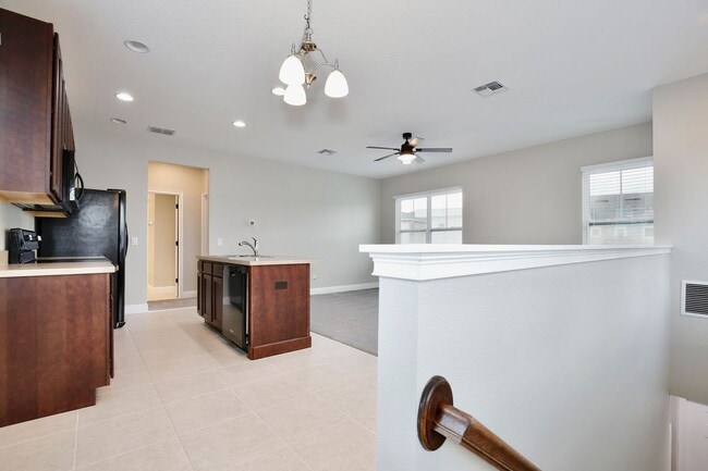 Building Photo - *Unfurnished* Beautiful 1/1 Spacious Garage Apartment in the Exclusive Laureate Park - Orlando!