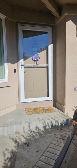 Front door with security camera - 1904 S Carr St