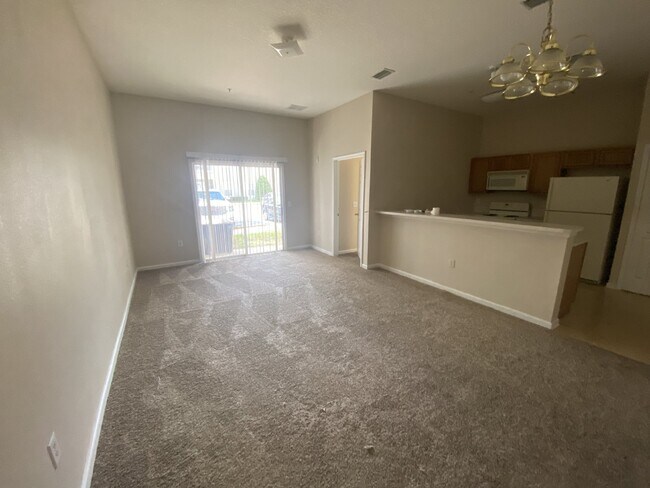 Building Photo - First-Floor 2BR/2BA Condo in Gated Nature’s Hideaway – Pool, Playground & Convenient Westside Loc...