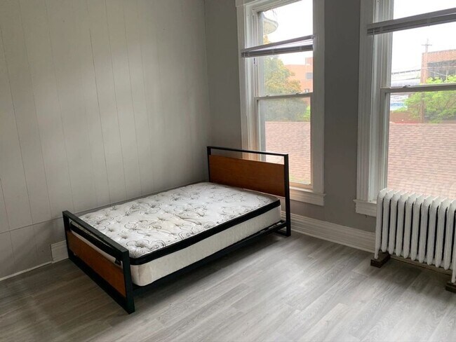 Building Photo - Stress-Free Stay: All-Inclusive Apartment Steps from Hospital