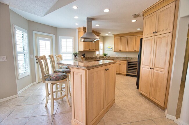 Building Photo - Seasonal Short-Term 2 Bed 2 Bath Heated Pool Villa with a Den in Harrington Lakes at Planation Go...