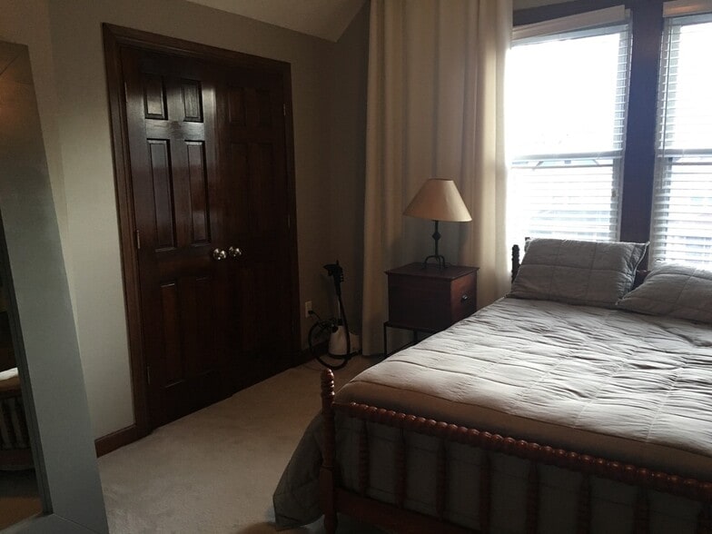 Master Bedroom with custom window coverings - 565 Delta Avenue