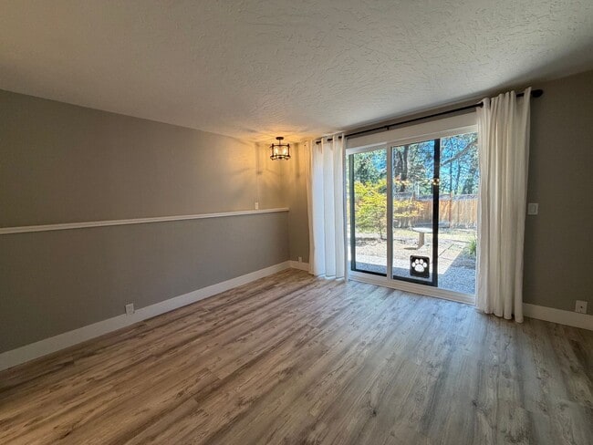 Building Photo - Spacious 4BR/3BA Home with Deck, Fenced Yard & Garage