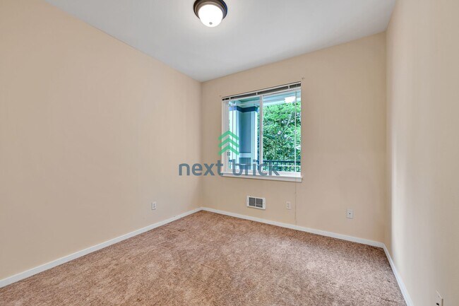Building Photo - Rare Ground-Floor, End Unit with massive b...