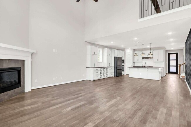 Building Photo - ASK ABOUT FREE APPLICATIONS THROUGH AUGUST!  "Spacious 4-Bedroom Sanctuary with Cozy Fireplace in...