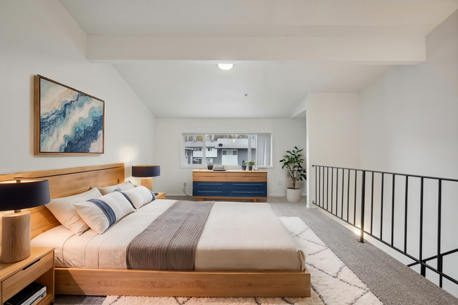 Experience tranquility in this spacious and elegantly designed bedroom. - Alturas Vose Townhomes