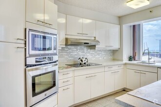 Building Photo - One Waterfront Towers Fully Furnished 2bed...