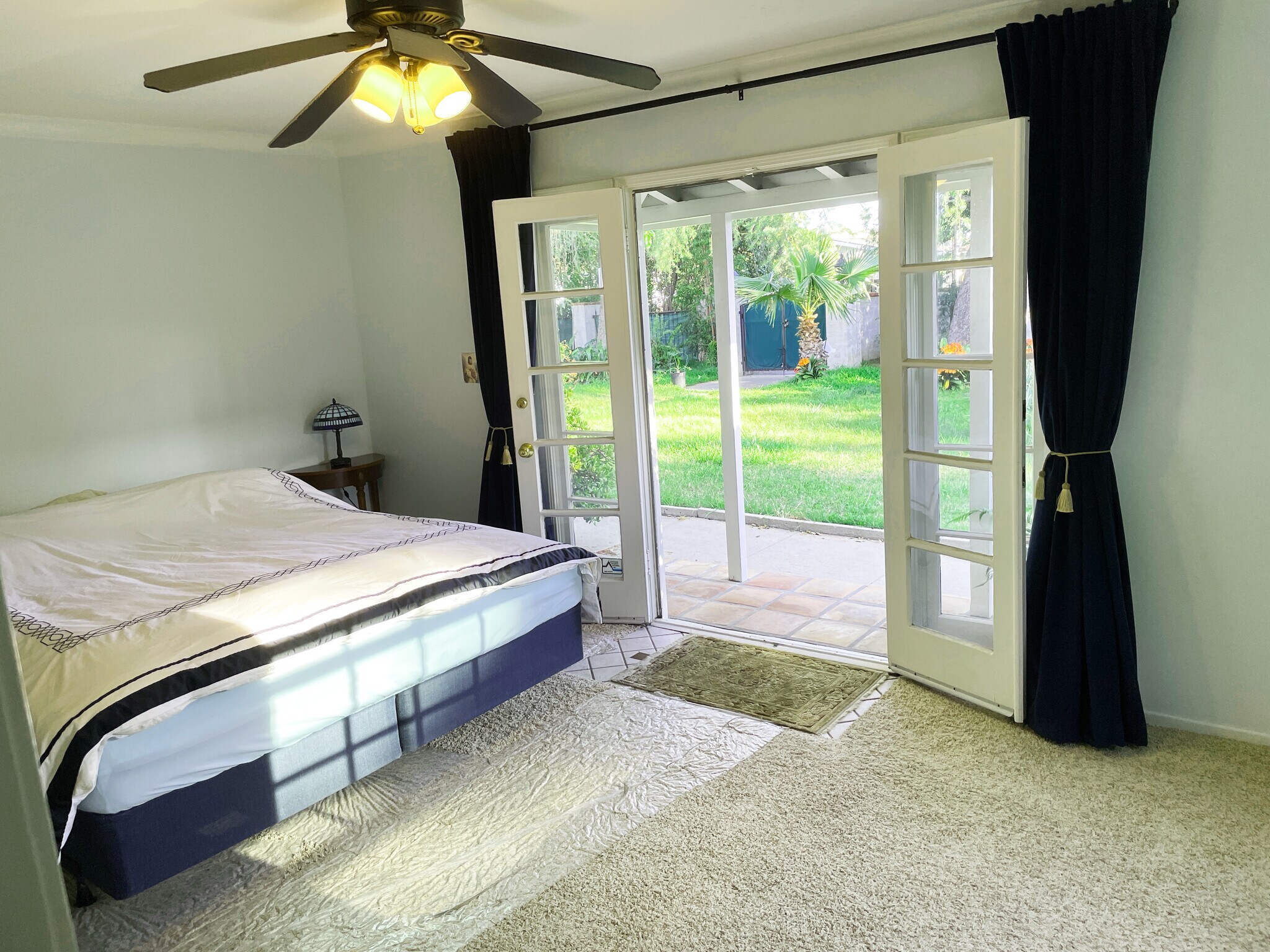 Primary Bedroom with French doors open to the front yard - 15341 Cohasset St