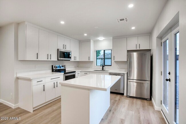 Building Photo - 8015 W Roma Ave