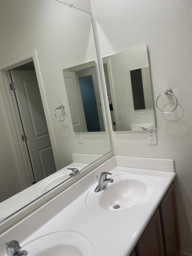 Hall bathroom with double vanity and tub/shower combo. - 1983 North 214th Dr