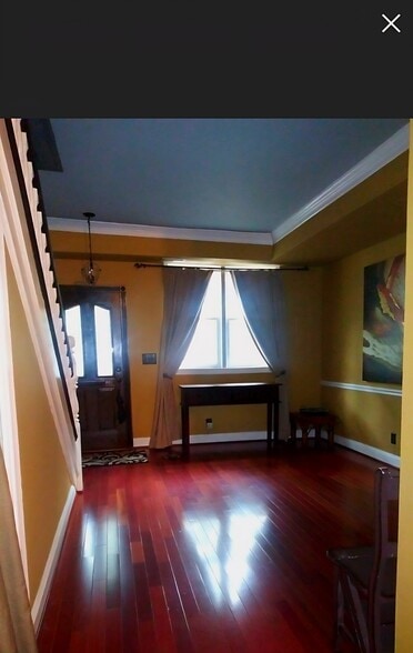 Living room with a fireplace - 730 6th St NE