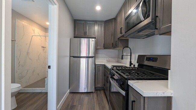 Building Photo - Fenced Private Yard in Newer Build Studio ...
