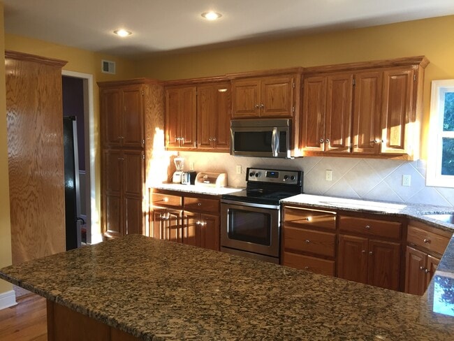 Building Photo - {7301} Quiet Cul-de-sac + Three Car Garage + Updated Kitchen + Finished Basement + Bedroom Level ...