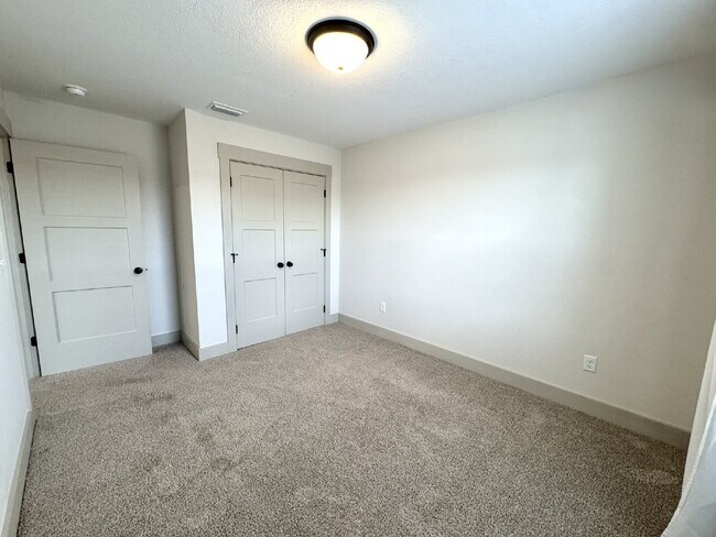 Building Photo - Need Space?  How about 5 bedrooms, 2.5 baths + an extra bonus area upstairs so that the kids can ...