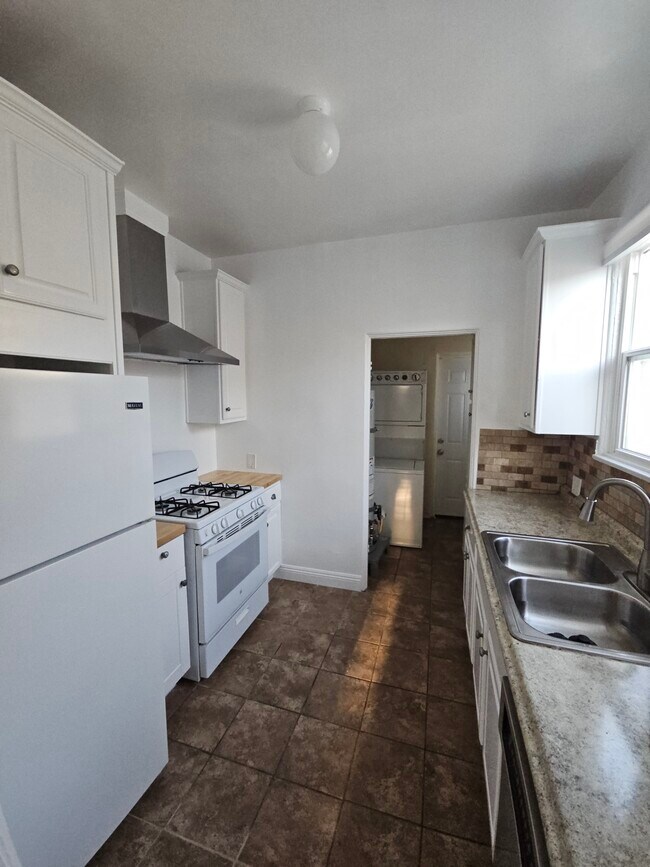 Kitchen leading to w/d room - 504 N Sweetzer Ave