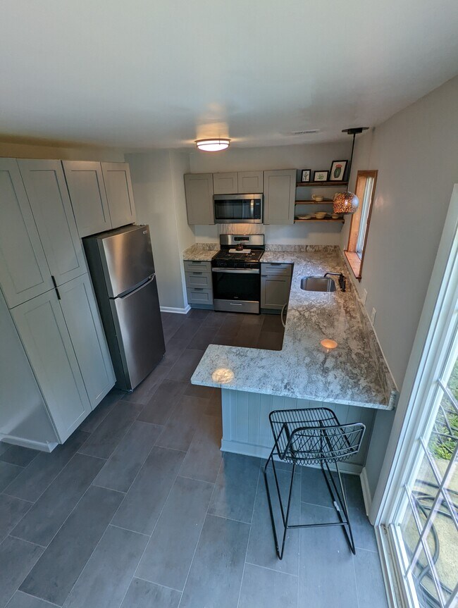 Kitchen is brand new, floor to ceiling, with all stainless appliances. - 2008 E Huntsville Rd