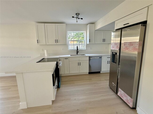 Building Photo - 6570 NW 6th Ct