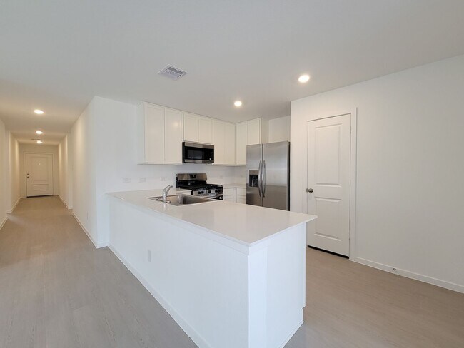 Building Photo - This great new single-story design makes smart use of the space available. At the front are all t...