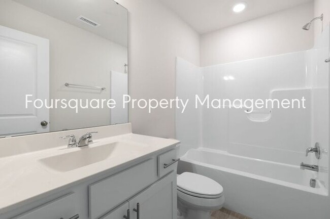 Building Photo - Stylish 3-Level Townhome with Bonus Suite, Deck & Garage – Near I-540 and Shopping