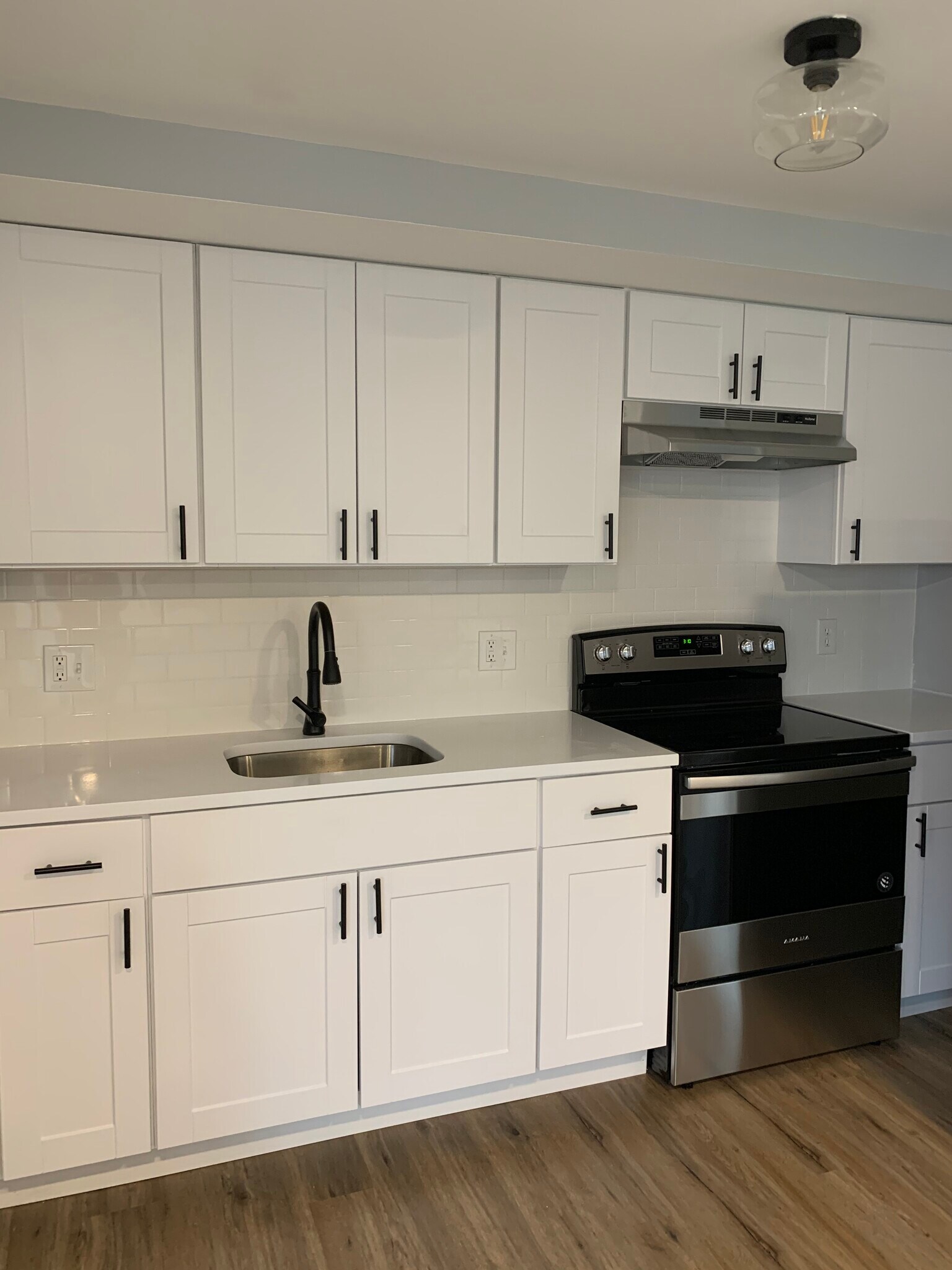 quartz counter tops and tiled backsplash - 343 Calvert St