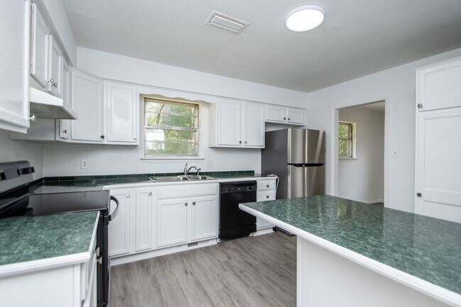 Building Photo - Welcome to a beautifully maintained 4-bedroom, 2-bathroom home located in the highly sought-after...